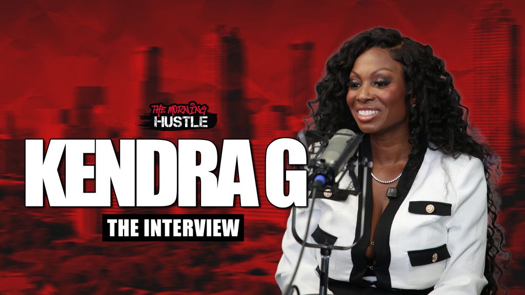 A smiling woman with curly hair speaking into a microphone on a red-lit stage, with the text "The Morning Hustle" and "Kendra G The Interview" visible.