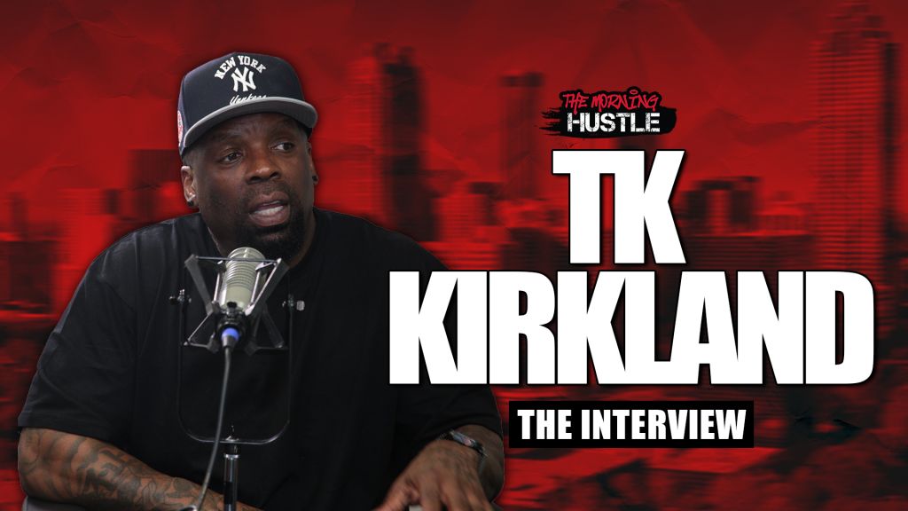 A man wearing a New York Yankees cap speaking into a microphone, with the text "The Morning Hustle" and "TK Kirkland The Interview" displayed behind him.